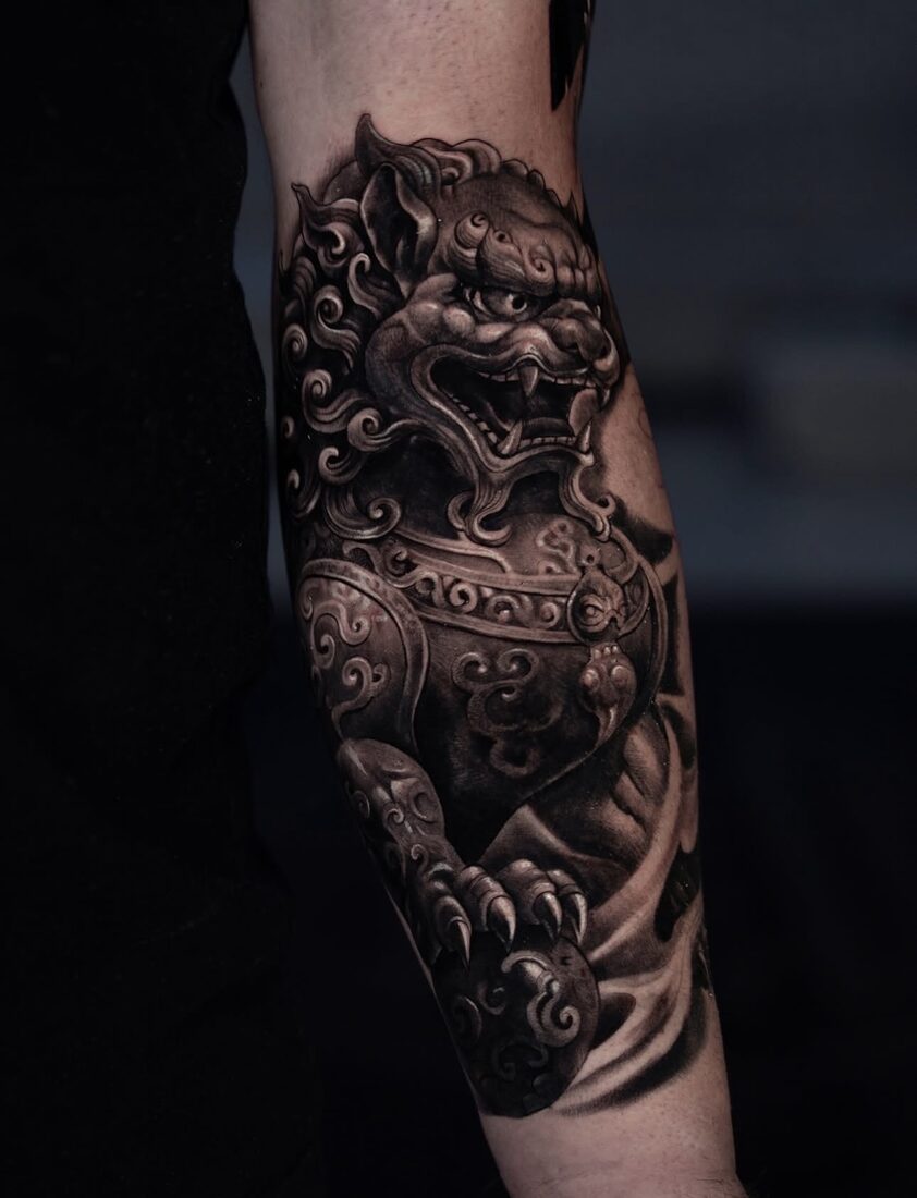 Black and grey realism foo dog guardian lion tattoo by Robert Pho